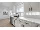 Modern kitchen sink with sleek faucet and white cabinetry at 9795 La Cienega St, Las Vegas, NV 89183