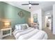 Main bedroom with green accent wall, and plenty of natural light at 9888 Abel Cliff St, Las Vegas, NV 89143