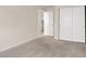 Bedroom with double door closet and access to laundry at 1006 Christopher View Ave, North Las Vegas, NV 89032