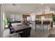 Kitchen dining area with large table and sliding door access to backyard at 1006 Christopher View Ave, North Las Vegas, NV 89032