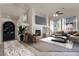 Virtually staged living room featuring fireplace and large sectional sofa at 1006 Christopher View Ave, North Las Vegas, NV 89032