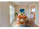 Bright dining area with modern orange table and chairs at 10484 Beautiful Fruit St, Las Vegas, NV 89183