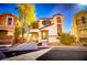 Two-story house with attached garage and landscaping at 10484 Beautiful Fruit St, Las Vegas, NV 89183