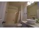 Clean bathroom with a bathtub, shower, and modern vanity at 10500 Eagle Nest St, Las Vegas, NV 89141