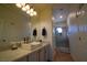 Bathroom with modern vanity and a walk-in shower at 10500 Eagle Nest St, Las Vegas, NV 89141