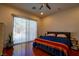 Main bedroom with hardwood floors, sliding glass doors and pool view at 10500 Eagle Nest St, Las Vegas, NV 89141