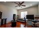 Bedroom with a home office setup and wood floors at 10500 Eagle Nest St, Las Vegas, NV 89141