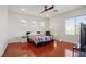 Bright bedroom with hardwood floors and a ceiling fan at 10500 Eagle Nest St, Las Vegas, NV 89141