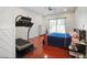 Bright bedroom with hardwood floors and a treadmill at 10500 Eagle Nest St, Las Vegas, NV 89141