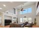 Spacious living room with high ceilings, a fireplace and ample natural light at 10500 Eagle Nest St, Las Vegas, NV 89141