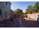 Landscaped side yard with a stone pathway at 10500 Eagle Nest St, Las Vegas, NV 89141