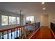 Upstairs hallway offering hardwood floors and views to the living room below at 10500 Eagle Nest St, Las Vegas, NV 89141