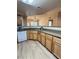 Kitchen with light wood cabinets, granite countertops, and island at 10550 W Alexander Rd # 2082, Las Vegas, NV 89129