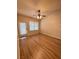 Spacious living room with laminate flooring and sliding glass doors at 10550 W Alexander Rd # 2082, Las Vegas, NV 89129