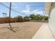 Gravel backyard with a concrete patio and wooden fence at 1105 I, Boulder City, NV 89005