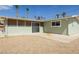 View of the back of the house and the gravel backyard at 1105 I, Boulder City, NV 89005