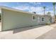 Side view of the house showcasing its light green exterior at 1105 I, Boulder City, NV 89005