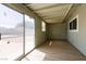 Sunroom with sliding door access to backyard and wood-look flooring at 1105 I, Boulder City, NV 89005