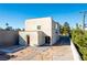 Modern stucco home with private backyard and orange door at 1303 S 8Th St, Las Vegas, NV 89104