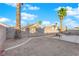 Backyard patio with seating area and palm trees at 1320 Indian Hedge Dr, North Las Vegas, NV 89032