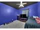 Bright bedroom with TV, dresser, and ceiling fan at 1320 Indian Hedge Dr, North Las Vegas, NV 89032