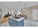 Open concept kitchen and dining area with island and hardwood floors at 1320 Indian Hedge Dr, North Las Vegas, NV 89032