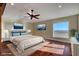 Spacious bedroom with large window and hardwood floors at 1323 Red Baron Ln, Boulder City, NV 89005