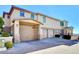 Two-story home with attached garage and paved driveway at 1323 Red Baron Ln, Boulder City, NV 89005