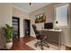 Home office with built-in shelving and hardwood floors at 1323 Red Baron Ln, Boulder City, NV 89005