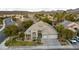 Stunning aerial view of a single-story house with a landscaped yard and a two-car garage at 1350 Rossini St, Henderson, NV 89052