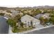 Single-story house with a two-car garage and landscaped yard at 1350 Rossini St, Henderson, NV 89052