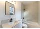 Clean bathroom with a quartz vanity top, bathtub and shower at 1350 Rossini St, Henderson, NV 89052