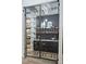 Modern wine cellar with glass enclosure, showing wine bottles and glasses at 1350 Rossini St, Henderson, NV 89052