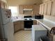 Kitchen features light wood cabinets and tiled floor at 1405 S Nellis Blvd # 1090, Las Vegas, NV 89104