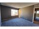 Bright bedroom with window and gray carpet at 1480 Hialeah Dr # B, Las Vegas, NV 89119