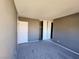 Bright bedroom with double closets and gray carpet at 1480 Hialeah Dr # B, Las Vegas, NV 89119