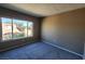 Spacious bedroom with large window and gray carpet at 1480 Hialeah Dr # B, Las Vegas, NV 89119