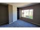 Bedroom with gray walls, gray carpet, and a closet at 1480 Hialeah Dr # B, Las Vegas, NV 89119