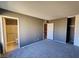 Spacious bedroom with en-suite bathroom and gray carpet at 1480 Hialeah Dr # B, Las Vegas, NV 89119