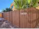 Building exterior with address marker and wooden fence at 1480 Hialeah Dr # B, Las Vegas, NV 89119