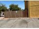 Exterior view of parking area with wooden fence at 1480 Hialeah Dr # B, Las Vegas, NV 89119