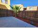 Small backyard with a concrete patio and palm tree at 1480 Hialeah Dr # B, Las Vegas, NV 89119