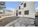 House's backyard features a flagstone patio and gravel landscaping at 1614 Redhawk Ct, Henderson, NV 89074