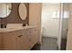 Double vanity bathroom with dark floor tile at 1804 Piccolo Way, Las Vegas, NV 89146