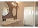 Double vanity bathroom with wood wall accents at 1804 Piccolo Way, Las Vegas, NV 89146