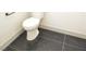 Clean bathroom with dark tile floor and modern toilet at 1804 Piccolo Way, Las Vegas, NV 89146