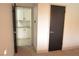 Bedroom with access to laundry and dark door at 1804 Piccolo Way, Las Vegas, NV 89146