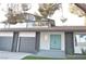 Modern two-story home with gray and white exterior, teal door, and artificial turf at 1804 Piccolo Way, Las Vegas, NV 89146