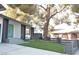 Landscaped front yard with artificial turf and mature tree at 1804 Piccolo Way, Las Vegas, NV 89146