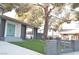 Landscaped front yard with artificial turf and mature tree at 1804 Piccolo Way, Las Vegas, NV 89146